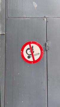 Danger flammable liquid safety sign on garage door