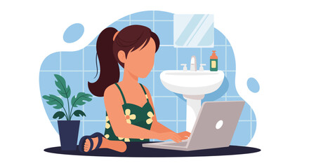A young woman with brown hair in a ponytail sits on the floor of a bathroom, using a laptop computer with a sink and plant in the background.