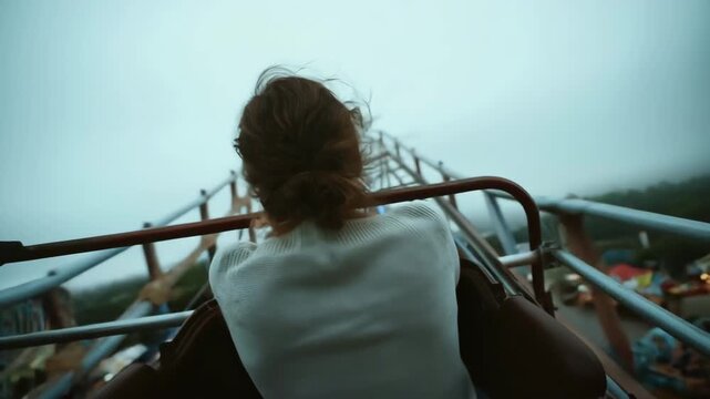 Woman Riding Roller Coaster Looking Forward With Anticipation
