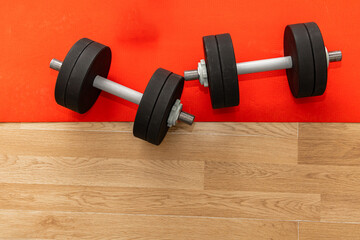 Dumbbells on a workout mat in a gym during morning exercise session