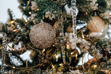 Decorated Christmas tree adorned with ornaments and lights during holiday season
