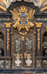 Baroque door. Golden coat of arms. Royal decor