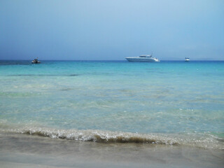 Beautiful Sea View in Olbia, Sardinia. Breathtaking sea view from the coastal city of Olbia in northeastern Sardinia, Italy. The image features crystal-clear turquoise waters, rugged Mediterranean