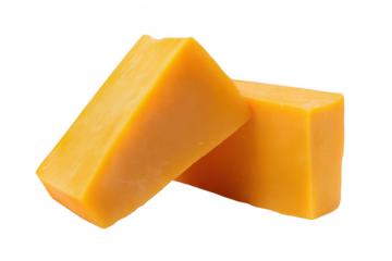 Two pieces of cheddar cheese isolated on a white background, png, transparent