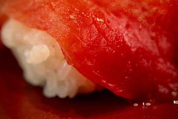 Close-up of delicate frothy bubbles gently floating on the steaming surface of rich, hot black coffee