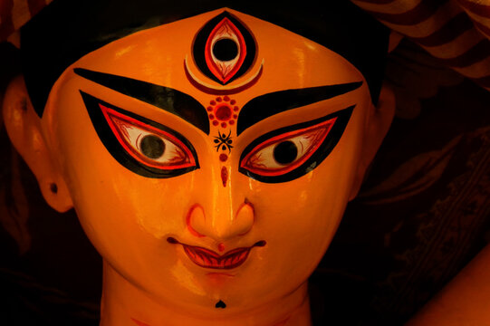 Close-up of Goddess Durga idol during upcoming Durga Puja festival in India, showcasing vibrant traditional artwork and divine expression.