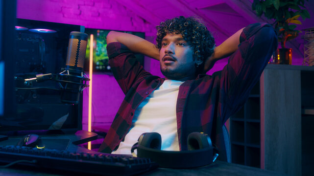 Close up hands Indian Arabian Latino American man keyboard computer control pc network remove headphones turn off end game playing esport relax enjoyment male guy streamer online technology blog vlog