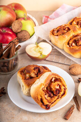 Apple cinnamon roll, sweet cinnabon buns with apple filling. Viral apple pie rolled buns, on beige...