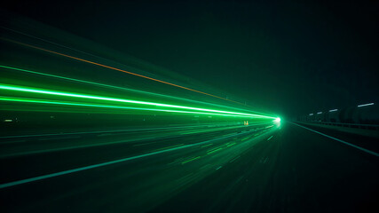 Green lights painting highway asphalt at night with long exposure