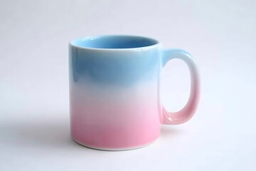 Fototapeta premium Blue and pink ceramic mug with ombre effect on white background for hot beverages