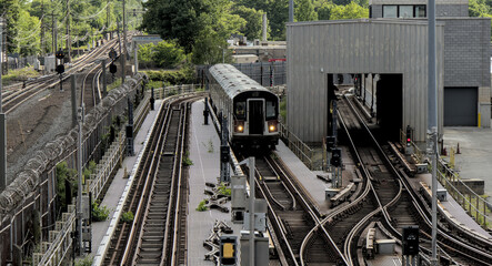 7 train running on above ground elevated tracks in flushing queens new york city (railroad commuter line)