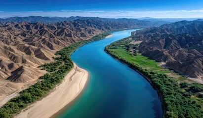 The winding Yellow River flows through the desert, surrounded by mountains on both sides