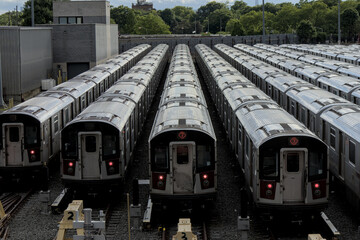 large group of 7 trains on tracks in train yard (corona flushing meadows queens new york city)...