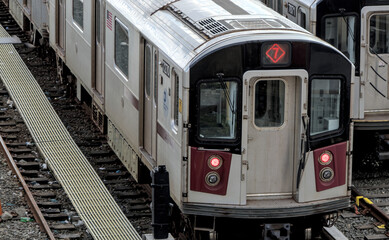 large group of 7 trains on tracks in train yard (corona flushing meadows queens new york city)...