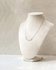 Dainty Minimalist Necklace Chain on Velvet neck mannequin display for permanent jewelry