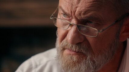 Confident successful old Caucasian man male mature takes off glasses looking at camera folded hands...