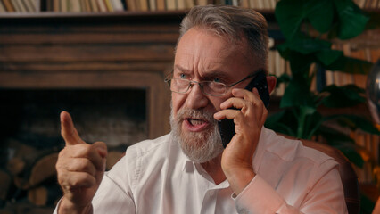 Confident successful old Caucasian man male mature takes off glasses looking at camera folded hands...