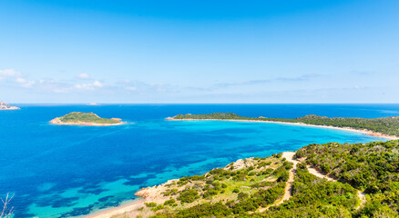 Green vegetation and blue sea in Capo Coda Cavallo