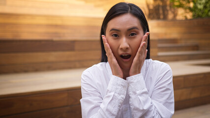 Shocked Asian Korean Chinese woman female girl emotions surprised open mouth amazed excited...