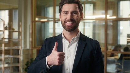 Happy man in office businessman raise finger thumb up good recommend business company portrait...