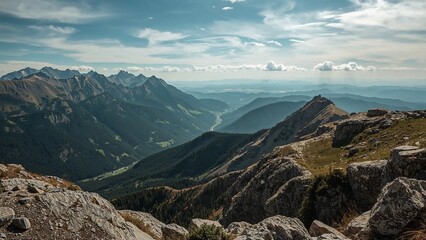 Obraz premium Expansive mountain vista with valleys and ridges.