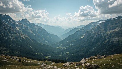 Obraz premium Expansive mountain valley panorama under a cloudy sky.