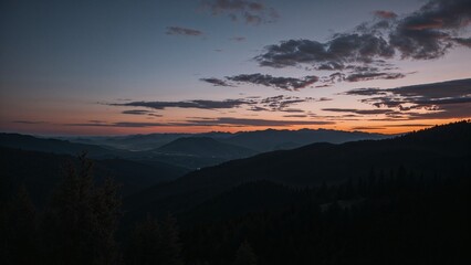 Obraz premium Mountain vista at sunrise with colorful sky.