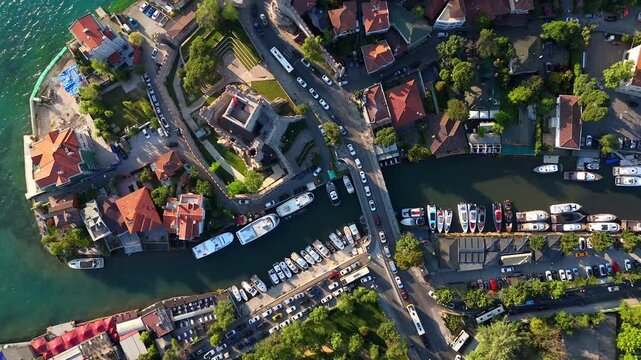 Top-down drone footage of Anadolu Fortress and G&ouml;ksu River in Istanbul&rsquo;s Asian side, featuring yachts, marina, historical architecture, coastal roads, and vibrant urban life.4k ultra hd bosphorus