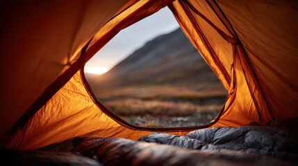 Early light viewed from a tent, alpine calm spreads across landscape

