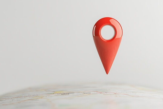 Red map pin pointing a location on a detailed road map with focus on navigation and destination planning. Location tracker and travel theme.