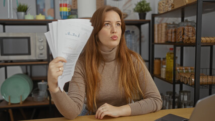 Woman with documents in a modern office setting appears frustrated, showcasing a dynamic workplace environment with various decorative elements.