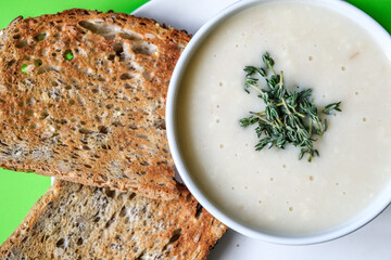  Bowl Of Traditional Chicken Soup With thyme Garnish And Toast