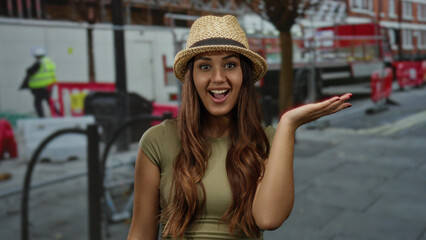 Young woman smiling at a construction site, wearing a stylish hat, showcasing happiness and charm...