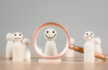 HRM or  Human Resource Management, Magnifier glass focus to manager icon which is among staff icons for human development recruitment leadership and customer target group concept.