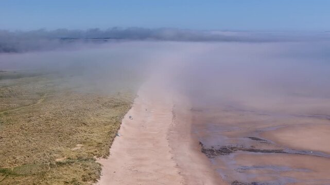 Aerial view of the beach with fog, United Kingdom.