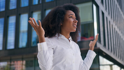 African American woman worker employer female emotional girl businesswoman outdoors mad displeased...
