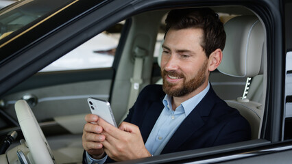 Caucasian man male businessman luxury new car buyer ownership mobile phone smartphone gadget auto...