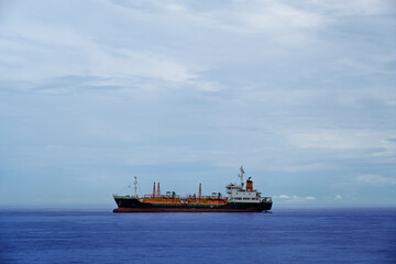 LNG Tanker ship (Liquefied Natural Gas)contrail in the ocean sea ship carrying container and running for export from container international port ocean, oil and gas with petrochemical thanker shipping
