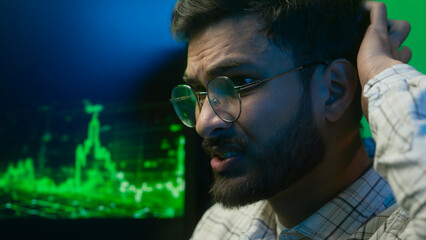 Close up face nervous Arabian Indian man looking computer monitor data problem trouble male guy...