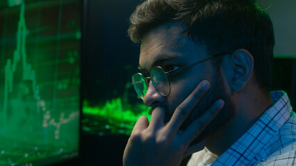 Displeased Indian Arabian man broker guy programming code cryptocurrency computer trading problem...