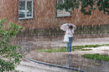 woman walking in a rain © talavietis