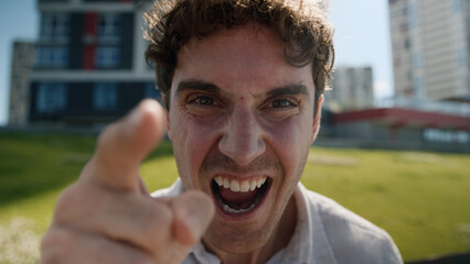 Close up angry Caucasian man male mad shouting at camera guy screaming stress city negative...