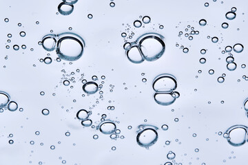 Beautiful swatch of shower gel on a blue background. View from below.