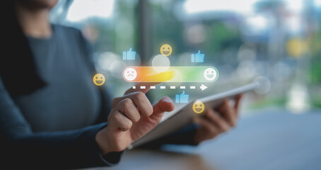 A person interacts with a tablet displaying holographic social media reaction icons including...