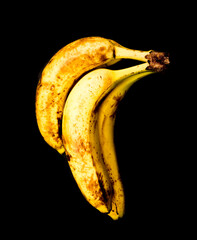 Overripe banana on a black background.