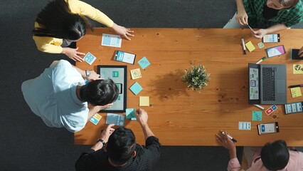 Programmer team brainstorm and plan Ux Ui design for mobile phone while present idea by using...