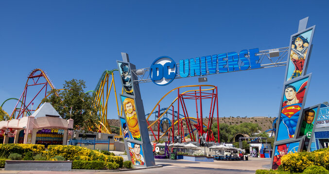 Six Flags California DC Universe amusement park roller coaster attraction, colorful superhero theme, travel destination, entertainment, leisure, adventure, vibrant park entrance scene