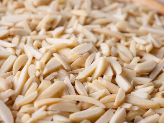 White Almond Stick set on wooden board and white background.
