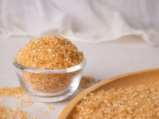 Organic Light Brown Sugar on wooden board.