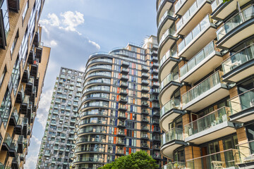 Contemporary apartment towers with curved glass balconies